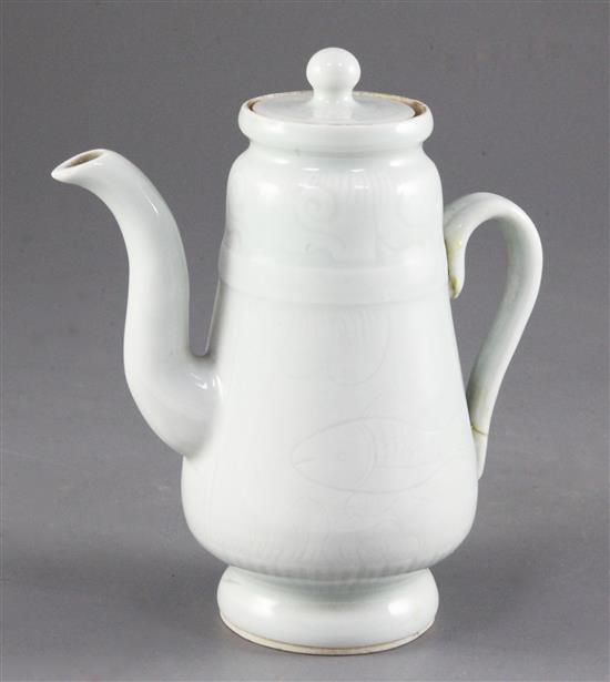 A Chinese pale celadon glazed wine pot and cover, probably Republic period, height 14.4cm, handle broken and restuck